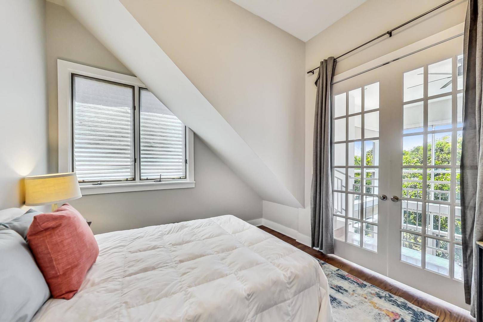 2035 North Leavitt Street, Unit 2 Chicago, IL 60647 - Photo 28 of 44 a bedroom with a bed and a large window