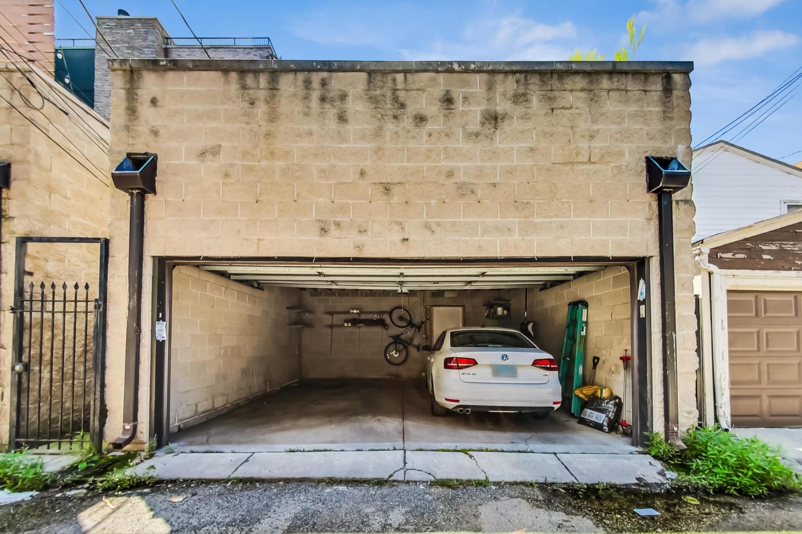 2035 North Leavitt Street, Unit 2 Chicago, IL 60647 - Photo 40 of 44 a car parked in front of a building