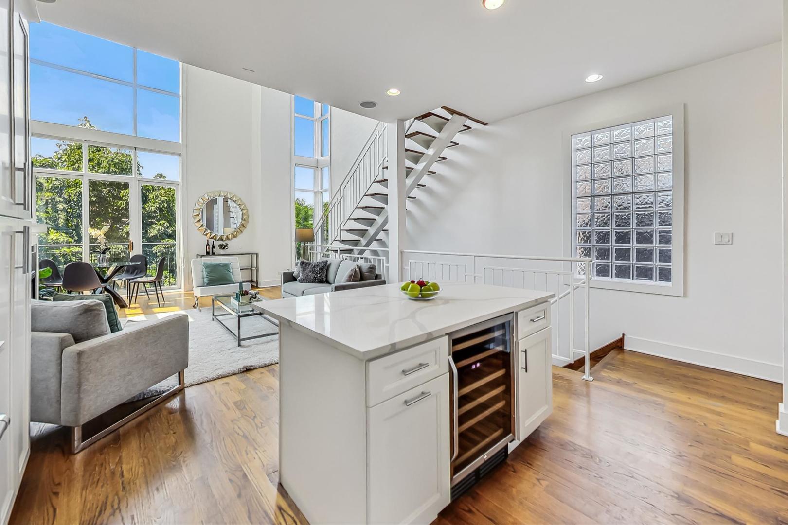 2035 North Leavitt Street, Unit 2 Chicago, IL 60647 - Photo 9 of 44 a view of kitchen with windows and wooden floor