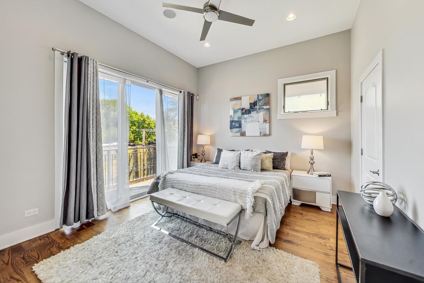 2035 North Leavitt Street, Unit 2 Chicago, IL 60647 - Photo 10 of 44 a spacious bedroom with a bed and a window