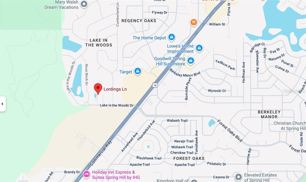 4289 Lordings Lane Spring Hill, FL 34607 - Photo 7 of 7 a utility room with a window and refrigerator