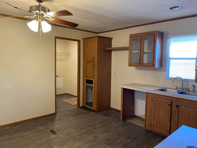 a view of a bathroom with a sink and a mirror