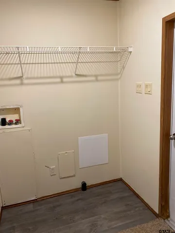 a view of a room with racks on the wall