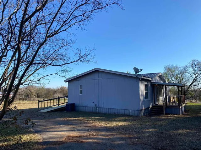 a view of a house with a big yard