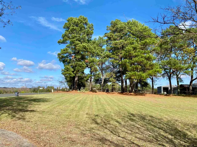 a view of an ocean with a building in the background