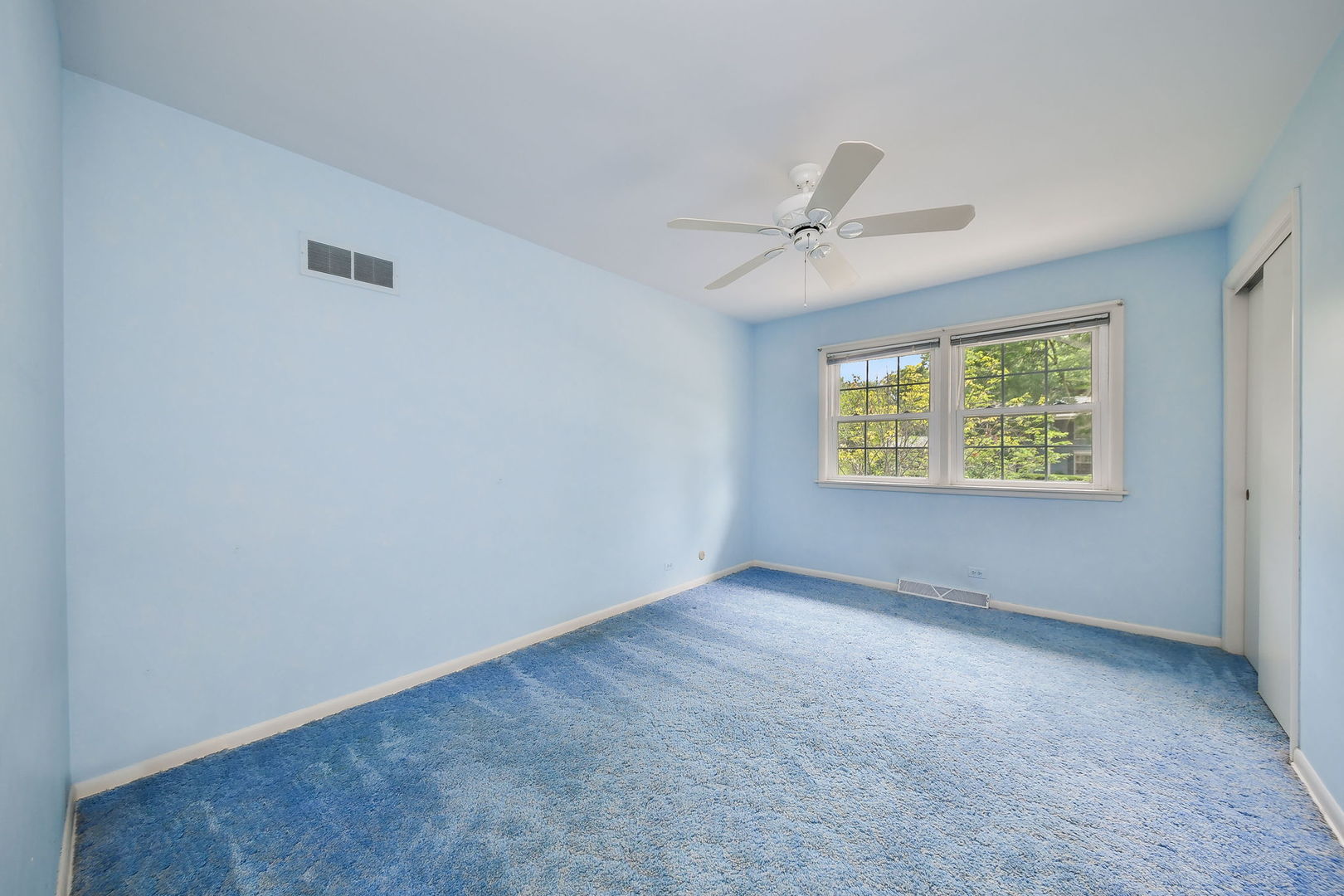 1344 South Main Street Wheaton, IL 60189 - Photo 11 of 20 an empty room with windows and ceiling fan