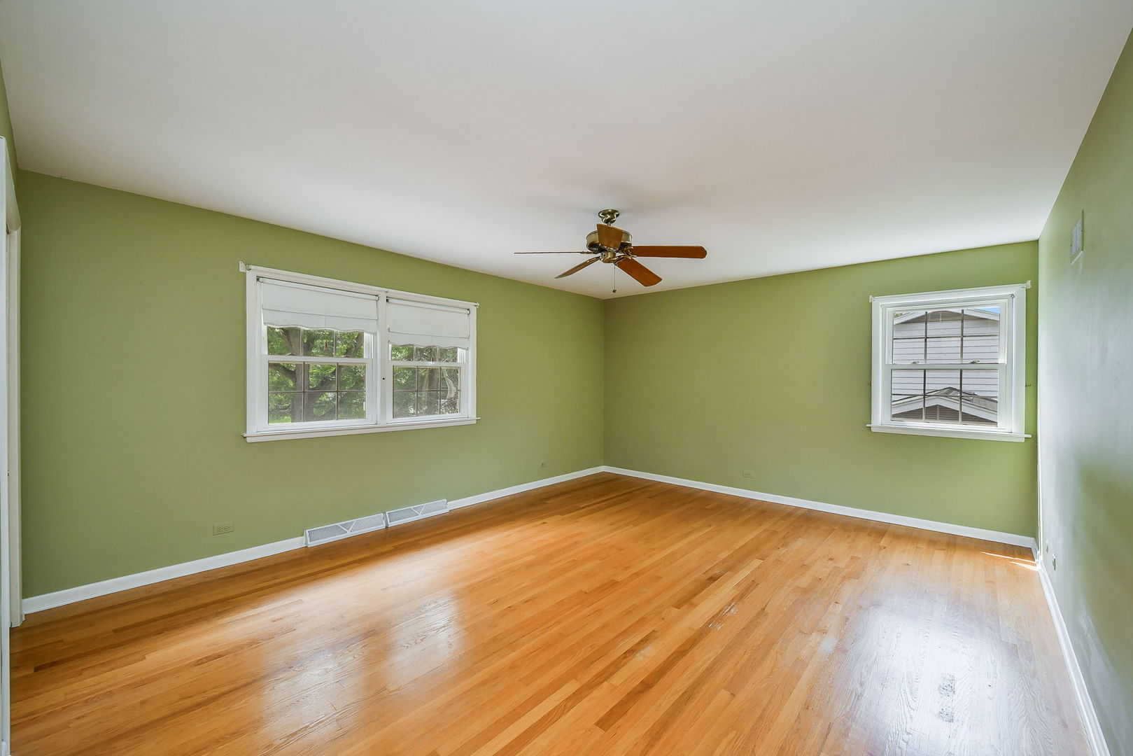 1344 South Main Street Wheaton, IL 60189 - Photo 8 of 20 a view of a room with wooden floor and fan