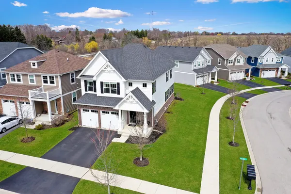 an aerial view of a house with a garden