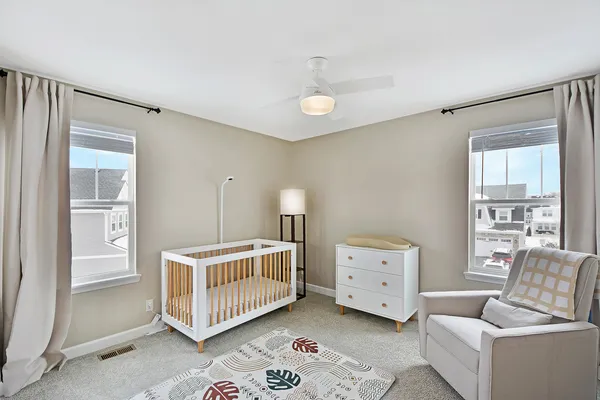 a bedroom with windows