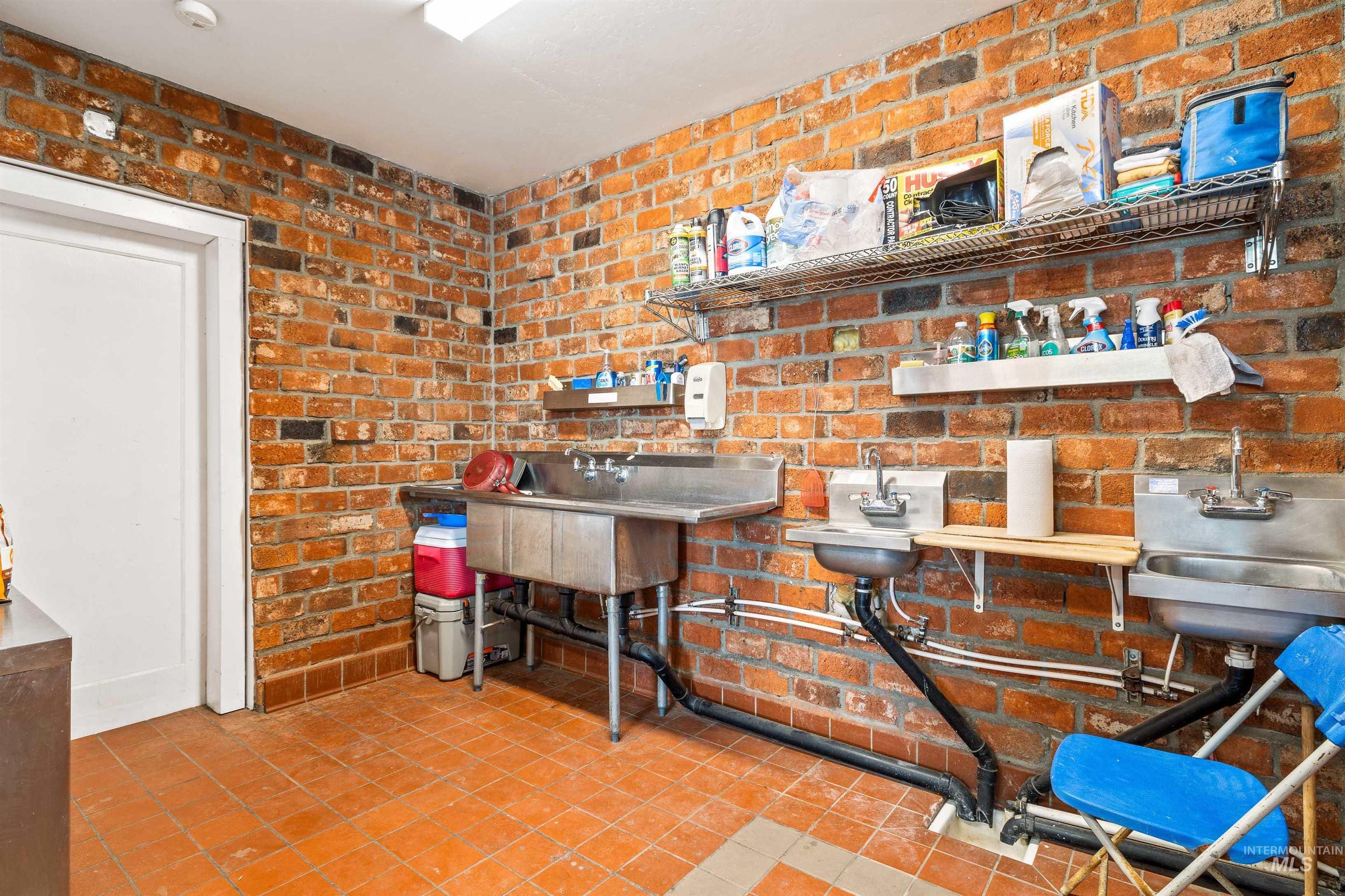 2039 Main Street Gooding, ID 83330 - Photo 13 of 31 Kitchen featuring brick wall and tile patterned floors