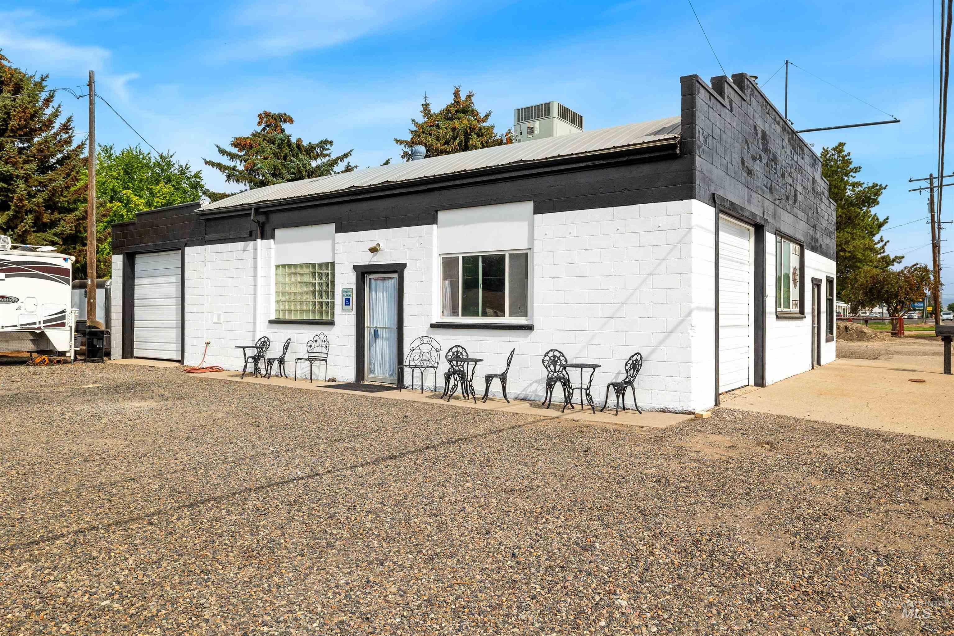 2039 Main Street Gooding, ID 83330 - Photo 2 of 31 View of front facade with concrete block siding and a metal roof