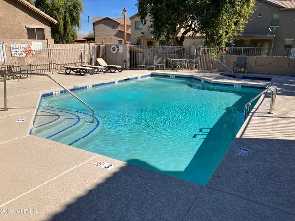 a view of a swimming pool with a patio