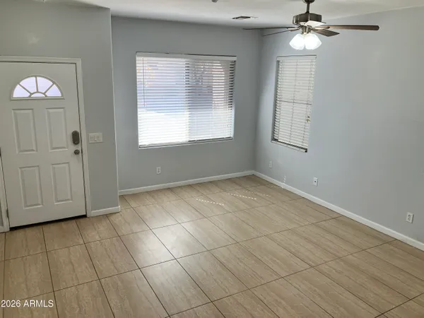 a view of an empty room with a window