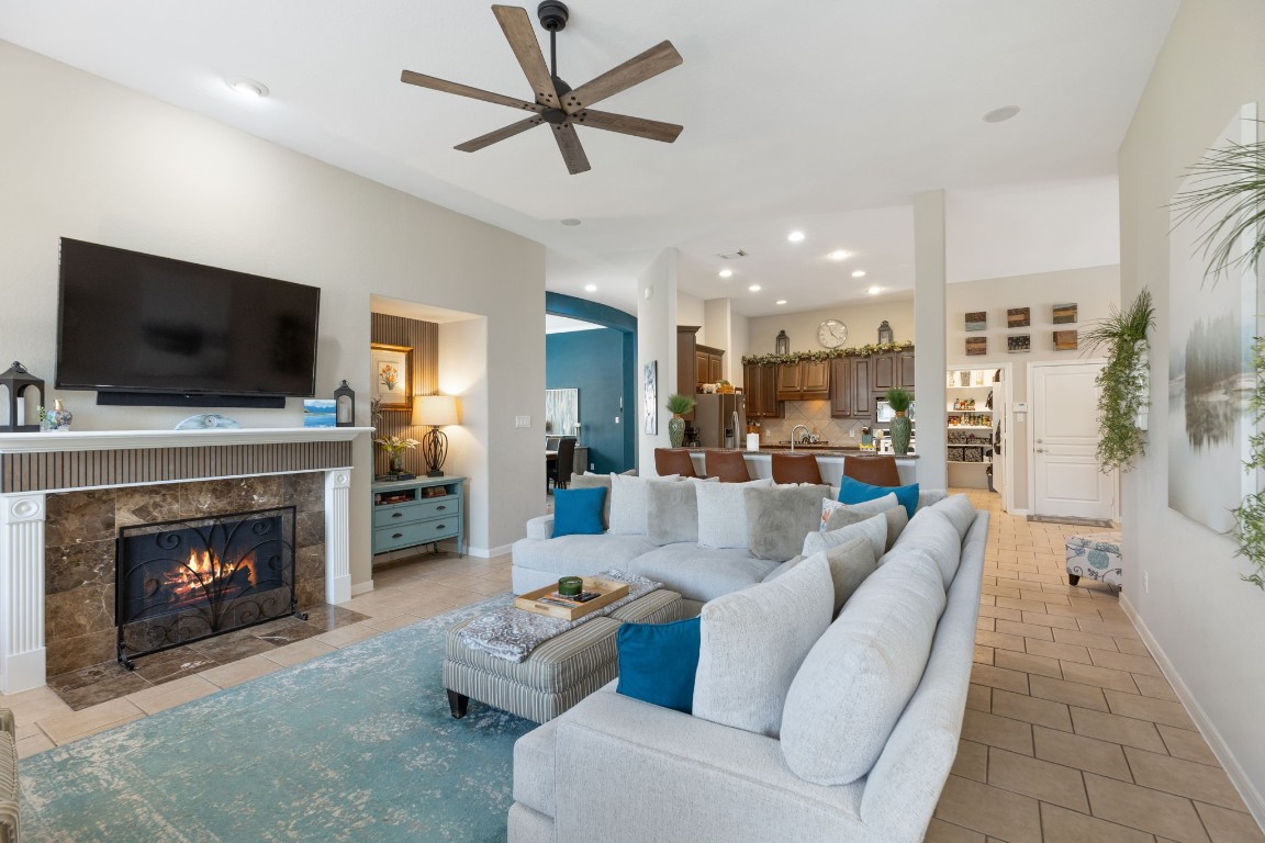 20410 Misty Crossing Lane Spring, TX 77379 - Photo 19 of 50 The family room is an inviting living area which flows into the kitchen and has breakfast bar seating and lots of natural light.