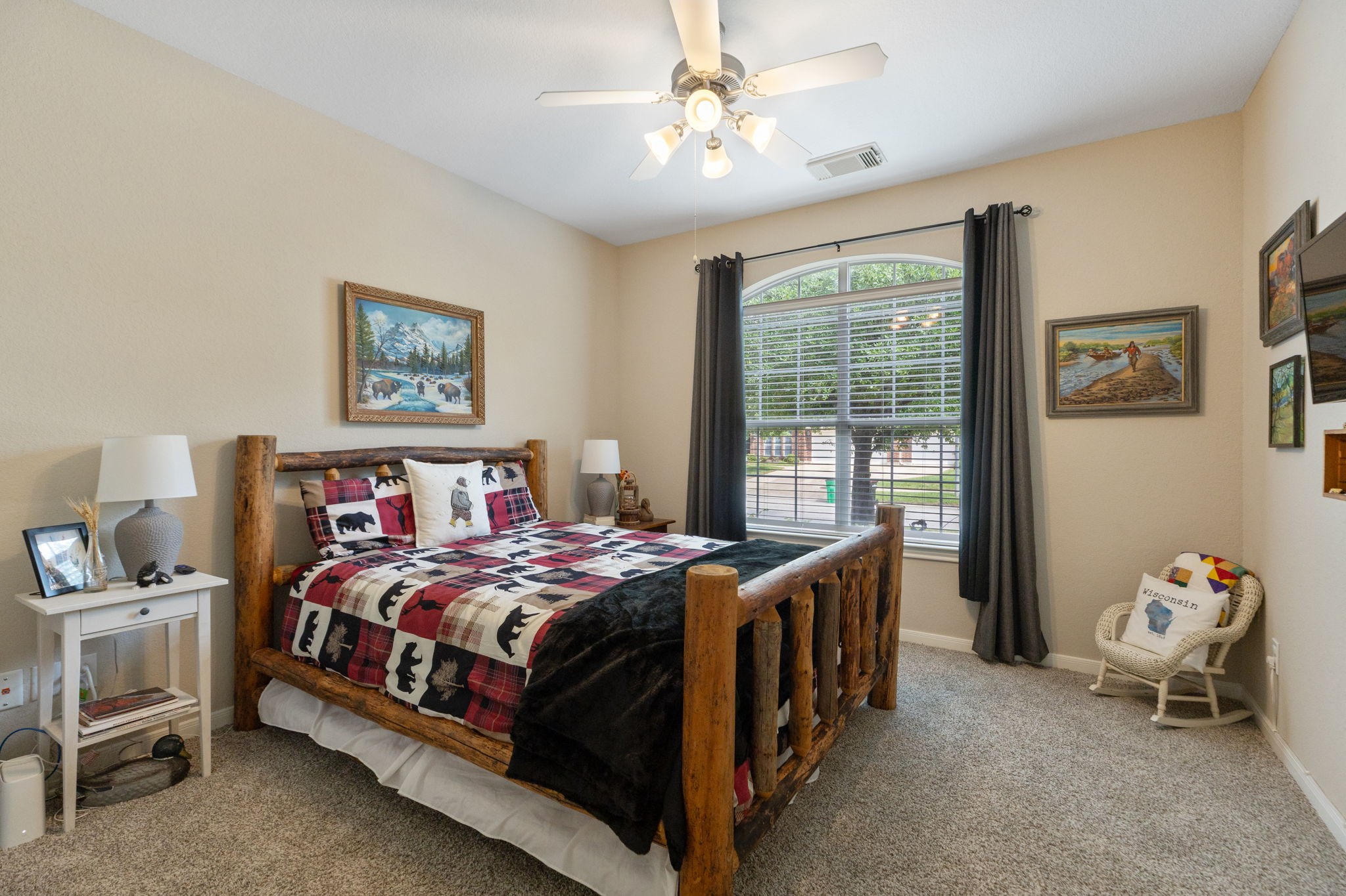 20410 Misty Crossing Lane Spring, TX 77379 - Photo 25 of 50 Upfront bedroom with rustic charm has a large window with carpet flooring, and neutral walls, creating a warm and inviting atmosphere.