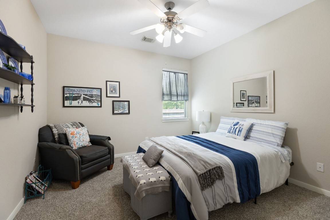 20410 Misty Crossing Lane Spring, TX 77379 - Photo 28 of 50 This cozy bedroom features neutral walls, carpeted flooring, and a ceiling fan. A window with natural light, and a just add your personal touch.