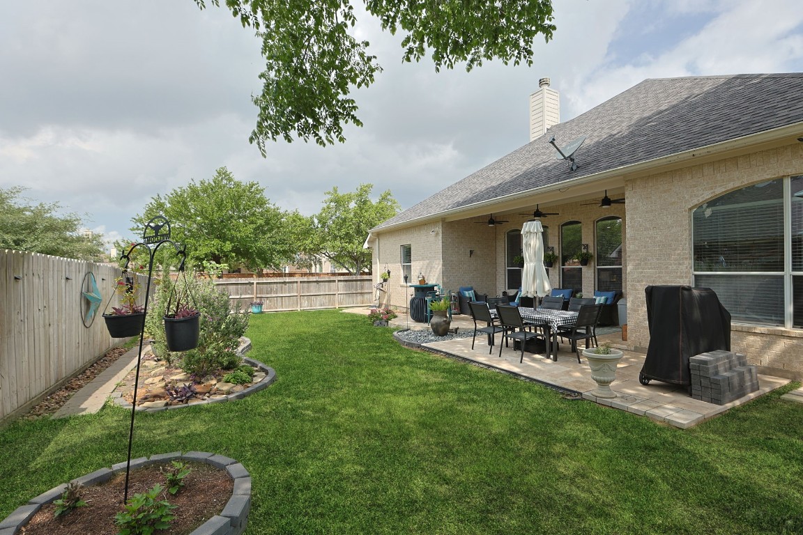 20410 Misty Crossing Lane Spring, TX 77379 - Photo 32 of 50 Lush green grass and lovely garden areas make this backyard a relaxing pleasure.