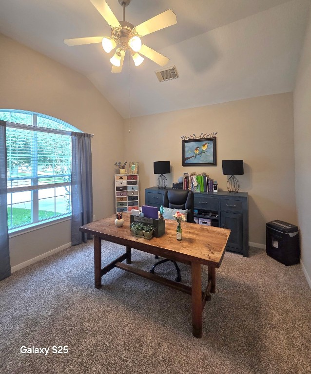 20410 Misty Crossing Lane Spring, TX 77379 - Photo 7 of 50 This bright, inviting home office features a large arched window with curtains, offering plenty of natural light. It has a high ceiling with a ceiling fan, carpeted floors, and is decorated with colorful artwork. This spacce creates a cozy and functional work environment.