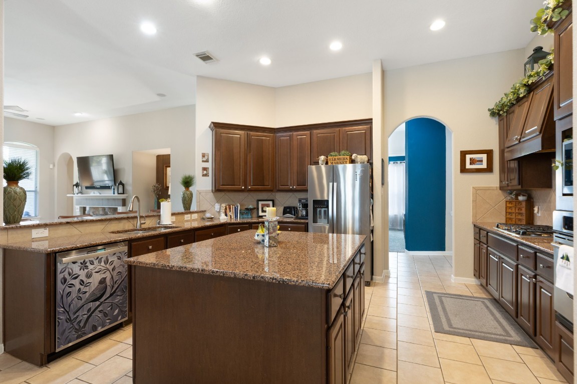20410 Misty Crossing Lane Spring, TX 77379 - Photo 8 of 50 The kitchen island is a great area in this spacious kitcheen for preparing your meals.