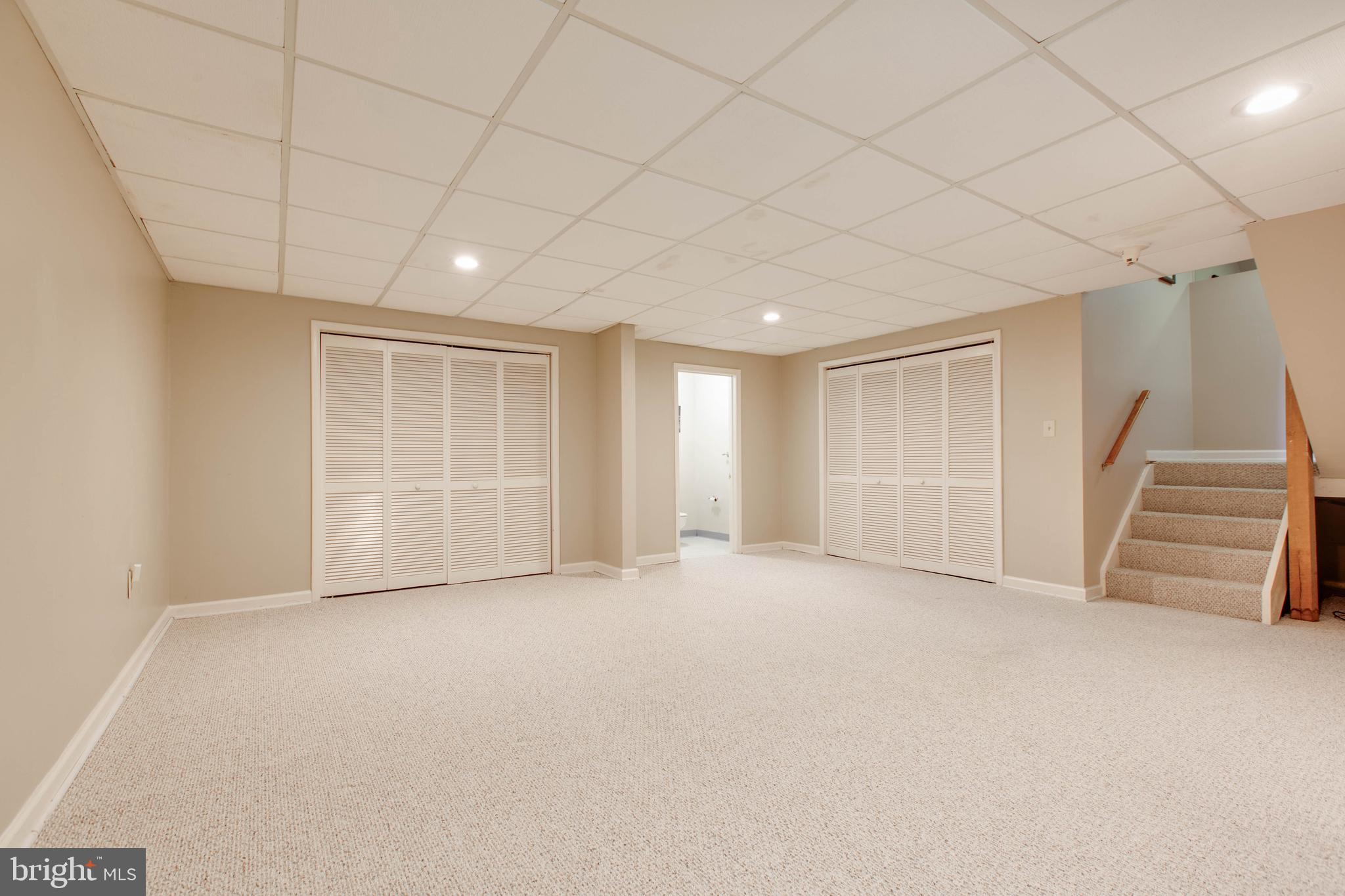 5519 Woodbine Road Sykesville, MD 21784 - Photo 62 of 69 a view of empty room with wooden floor and stairs