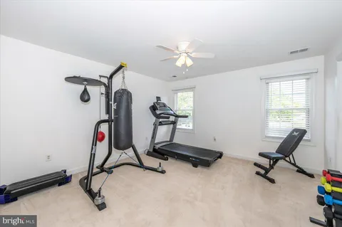 a bathroom with a sink a large mirror and a bathtub