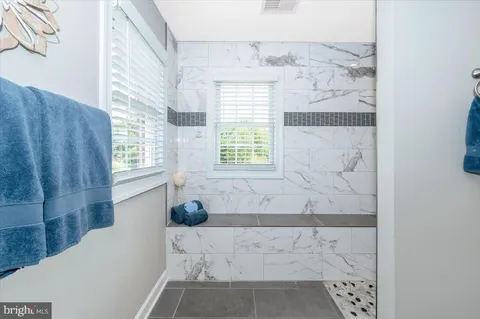 a view of hallway with wooden floor