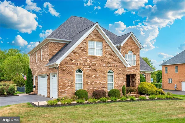 a view of a patio with a table chairs and a fire pit