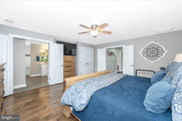 a kitchen with stainless steel appliances kitchen island granite countertop a stove a sink dishwasher a refrigerator a oven with a dining table and chairs