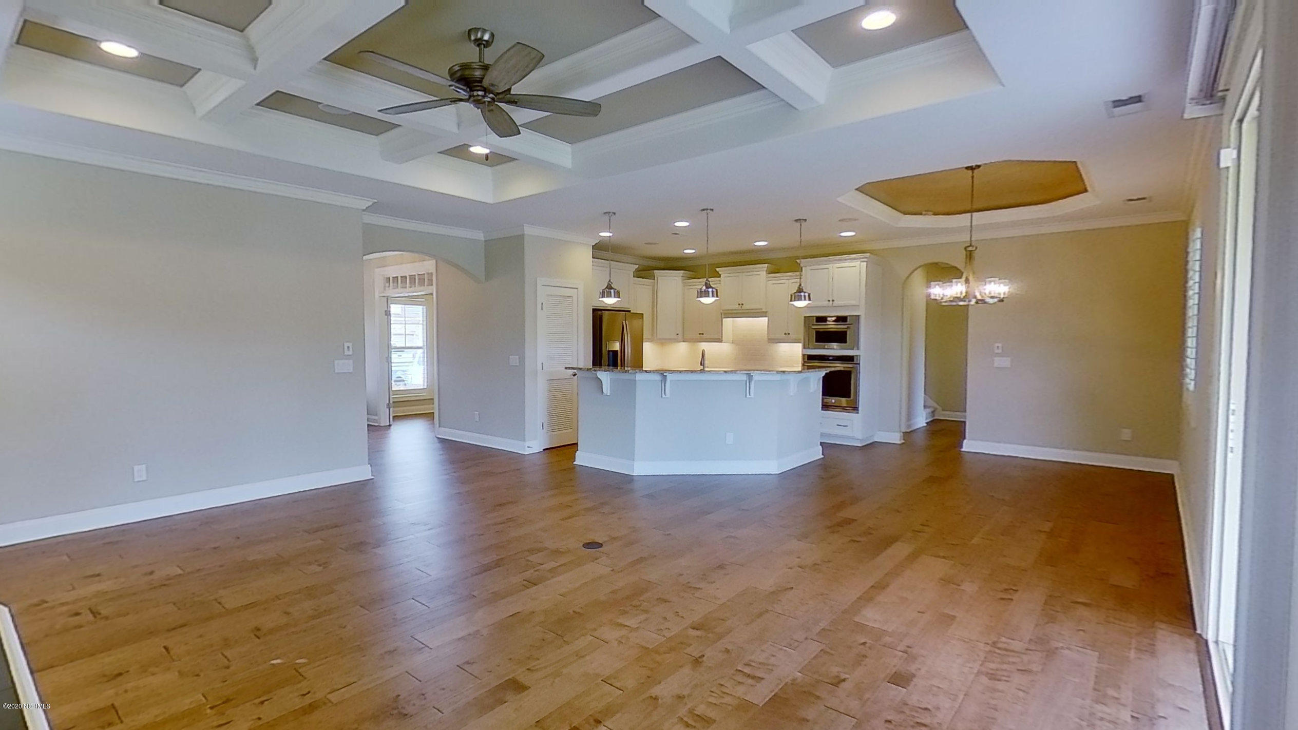 2140 Springstone Drive Leland, NC 28451 - Photo 13 of 38 View from living room into kitchen and dining room