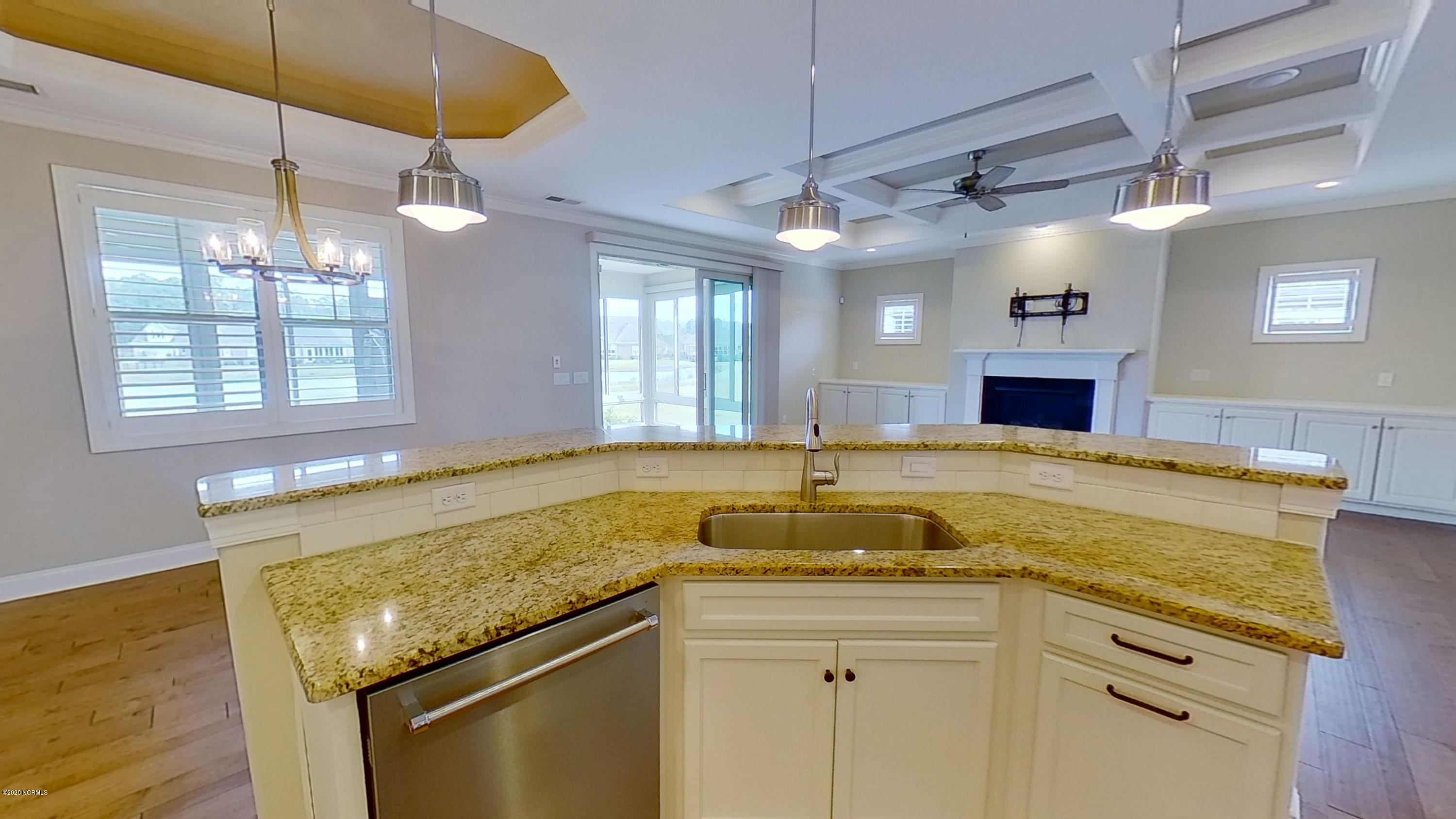 2140 Springstone Drive Leland, NC 28451 - Photo 18 of 38 View from kitchen into dining room and living room
