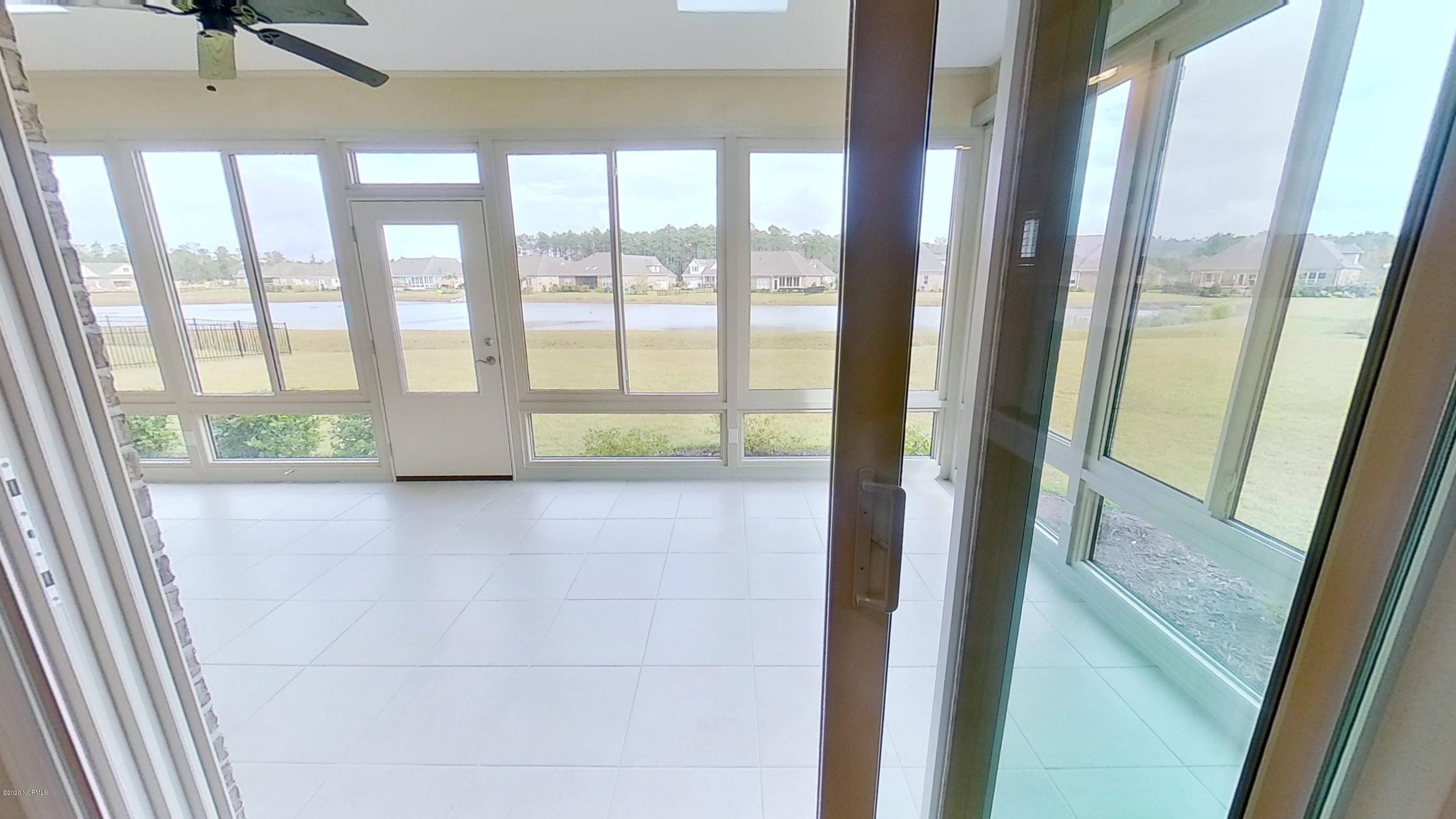 2140 Springstone Drive Leland, NC 28451 - Photo 19 of 38 View from living room into sunroom