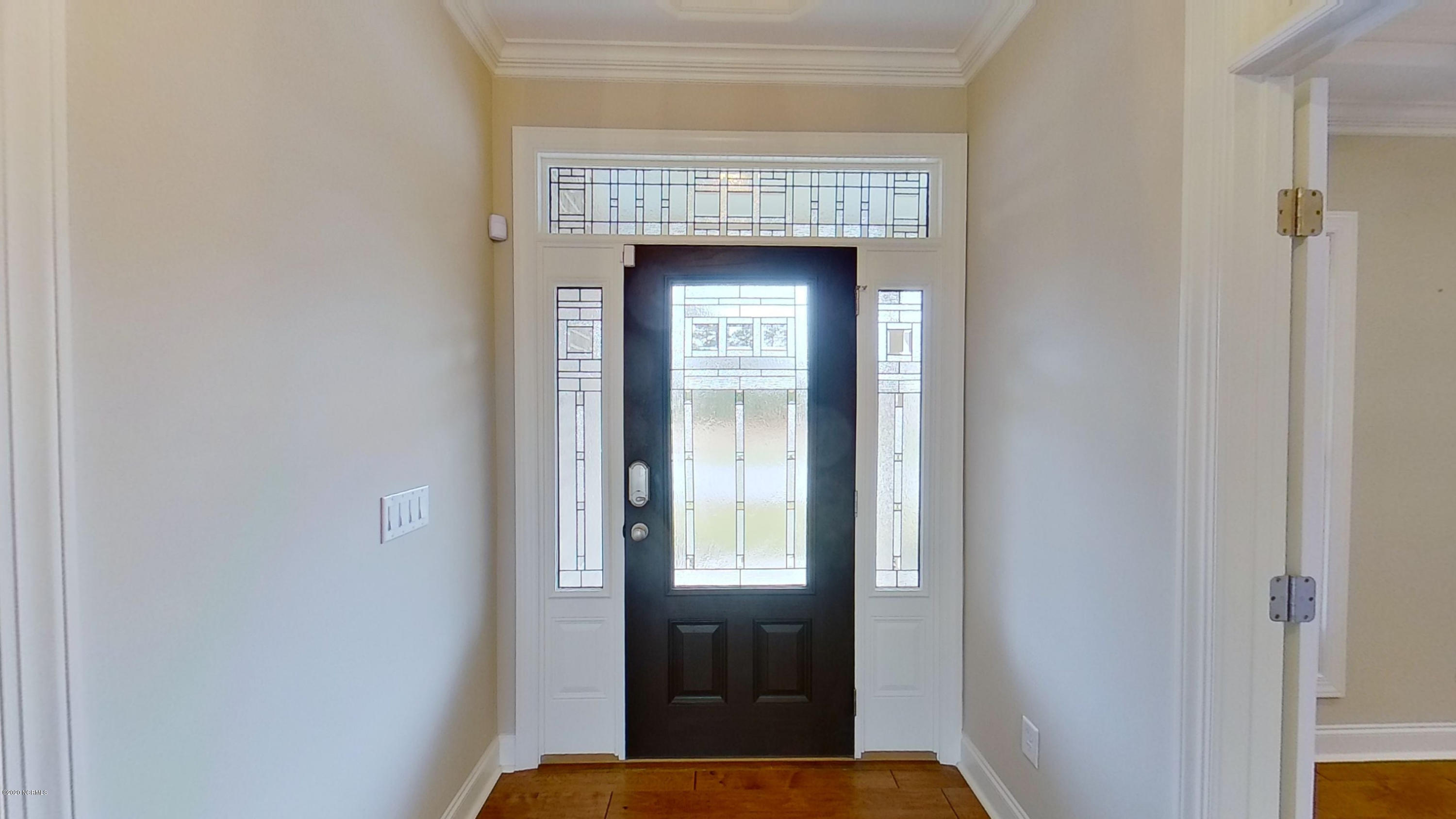 2140 Springstone Drive Leland, NC 28451 - Photo 4 of 38 Front entrance with leaded glass front door, sidelights and transom
