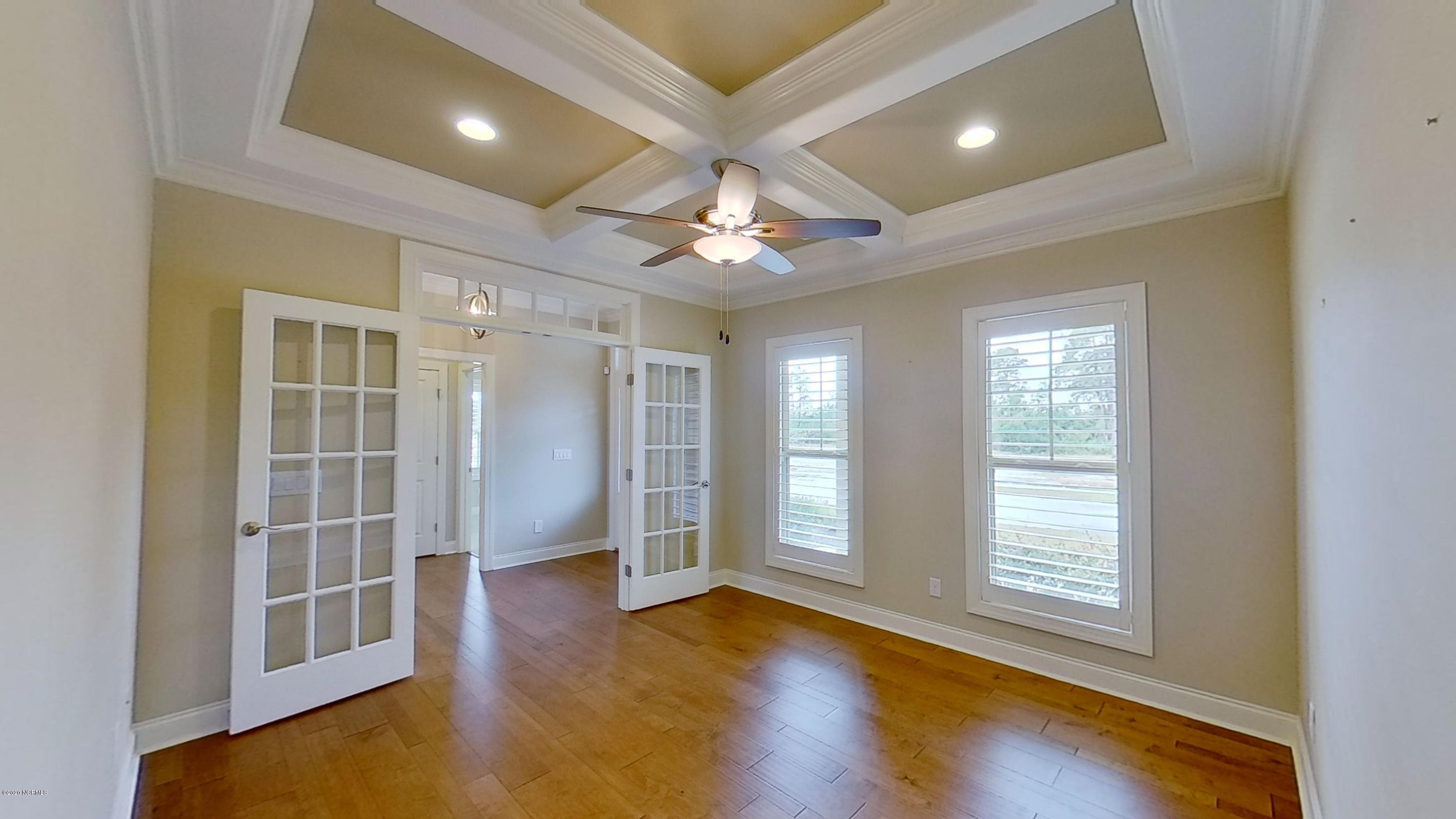 2140 Springstone Drive Leland, NC 28451 - Photo 6 of 38 Office with French door entrance and decorative coffered ceiling
