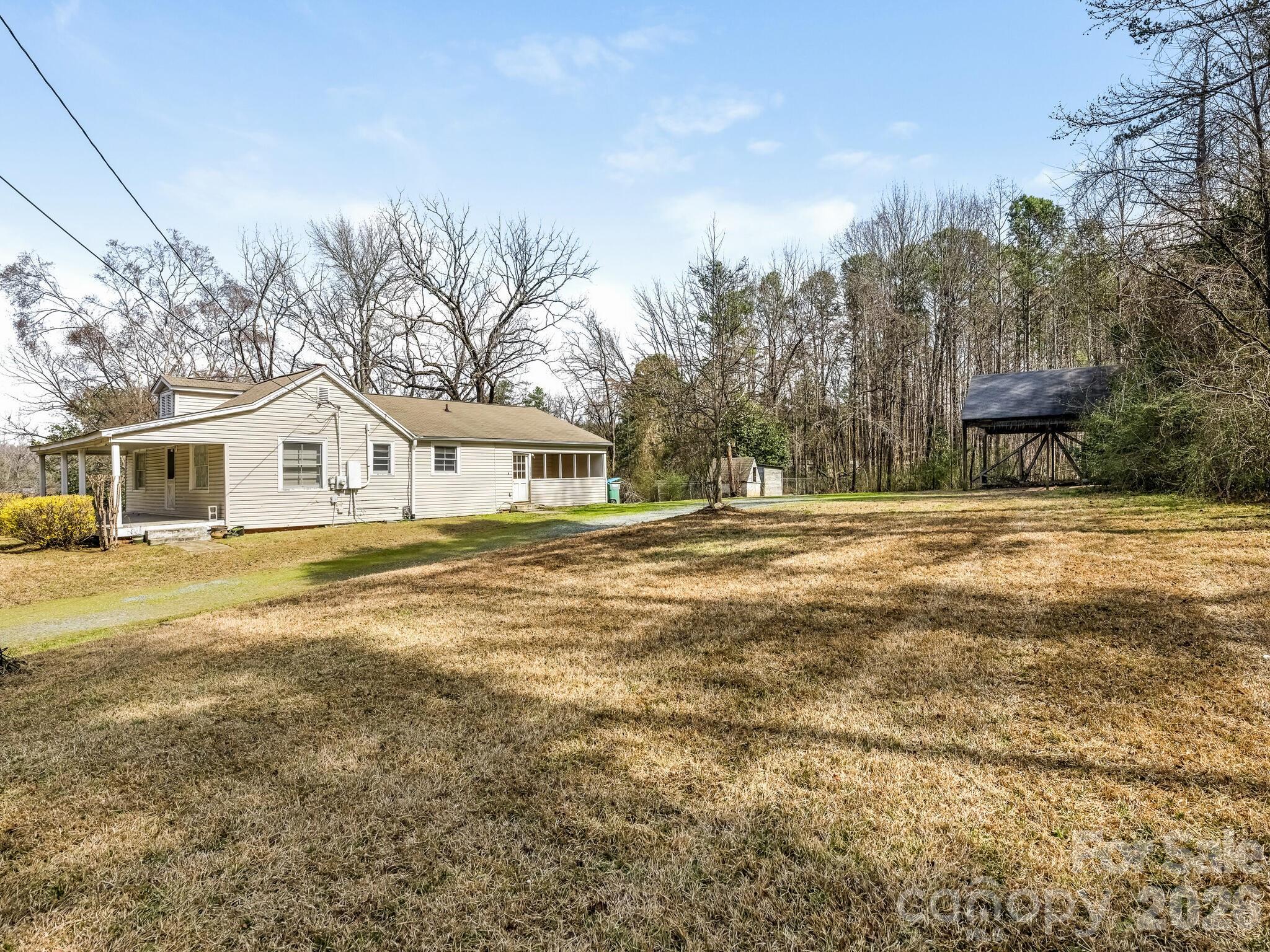 2346 Sam Newell Road Matthews, NC 28105 - Photo 16 of 18 a house with trees in the background