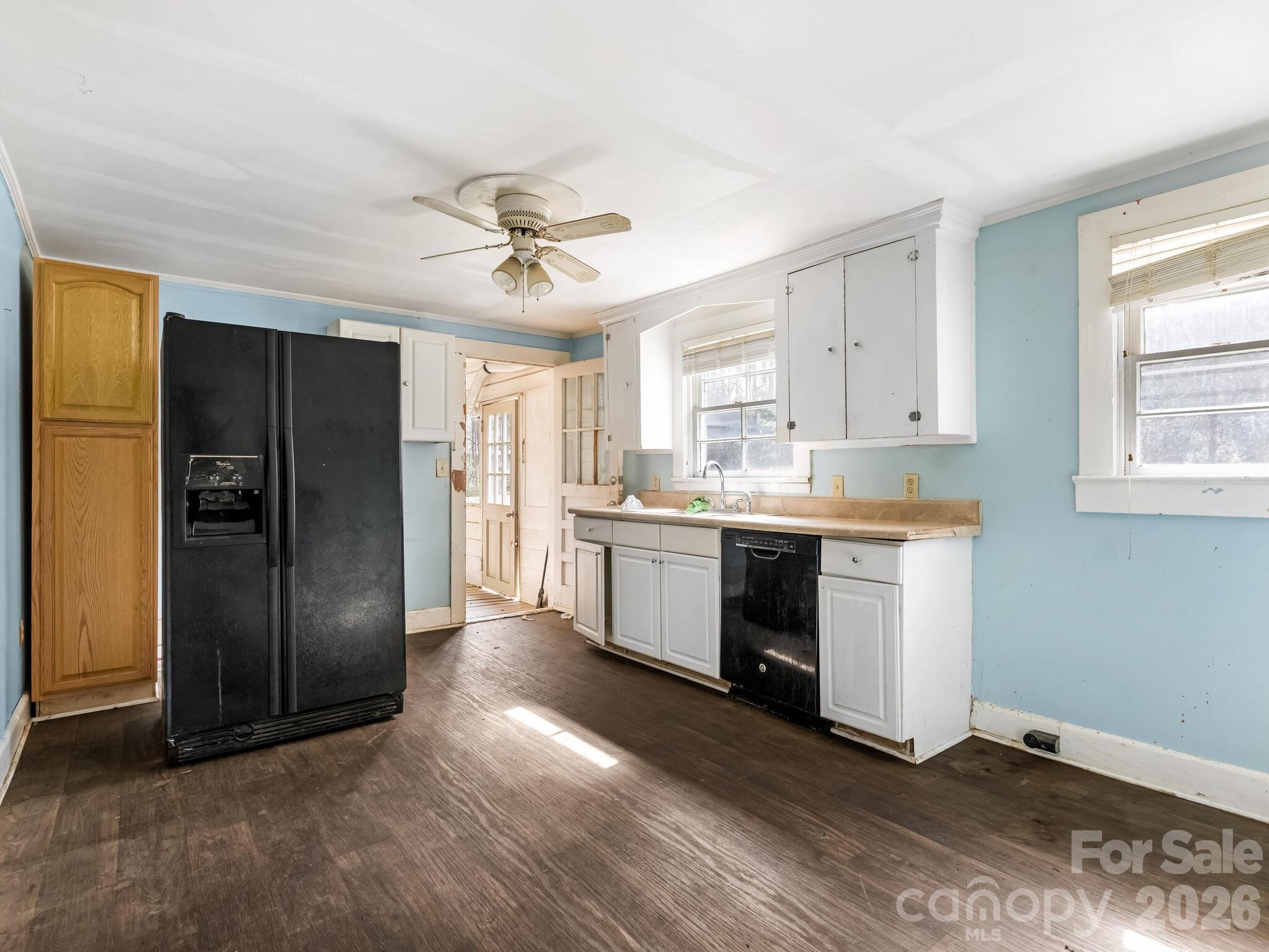 2346 Sam Newell Road Matthews, NC 28105 - Photo 4 of 18 a kitchen with stainless steel appliances a refrigerator sink and cabinets