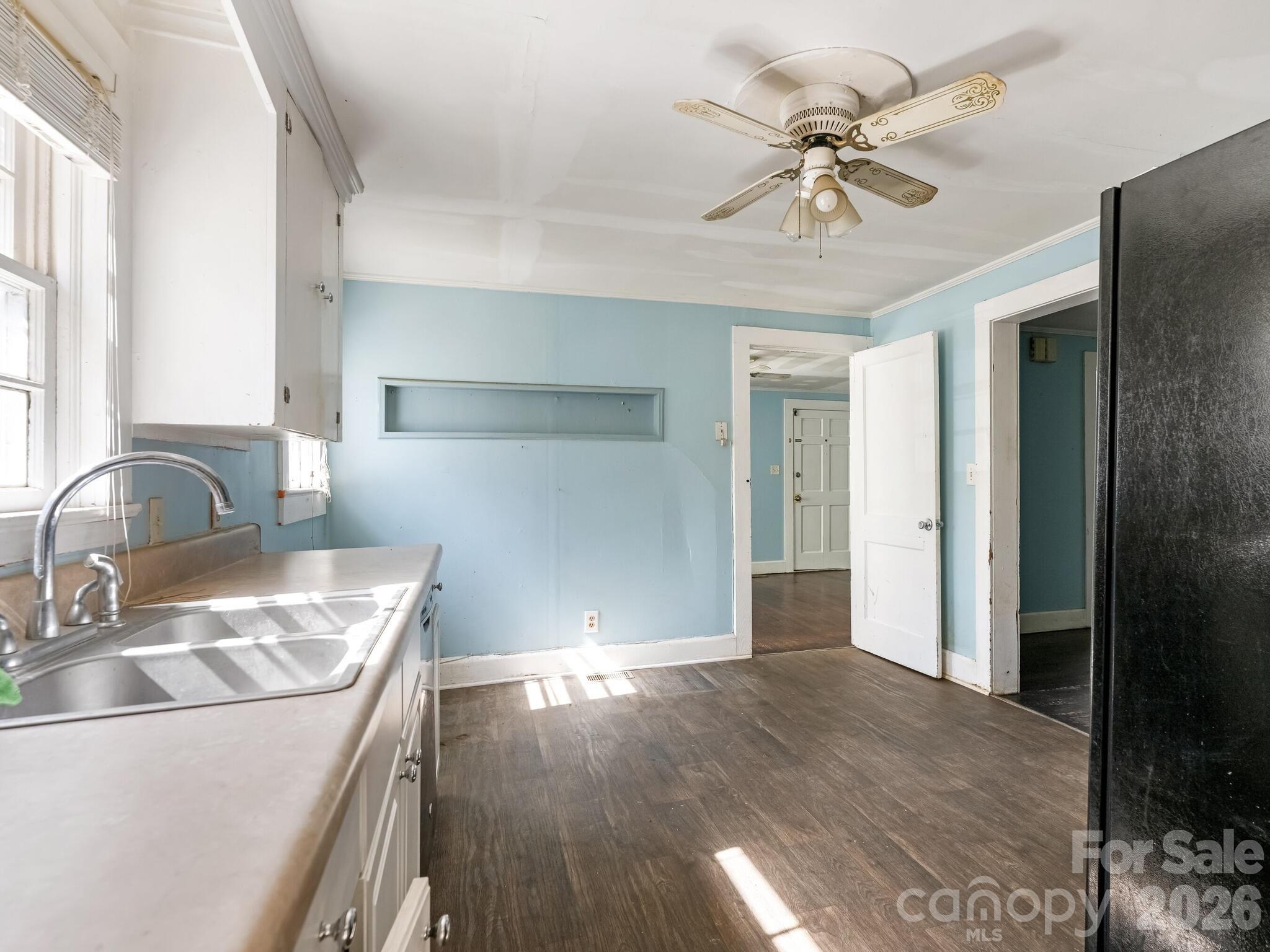2346 Sam Newell Road Matthews, NC 28105 - Photo 5 of 18 a view of a kitchen with wooden floor and a sink