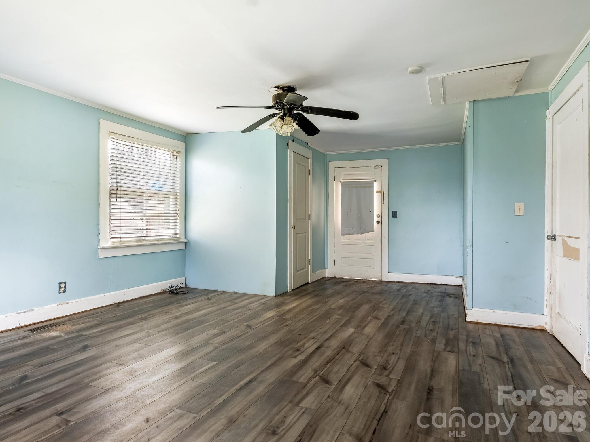 2346 Sam Newell Road Matthews, NC 28105 - Photo 8 of 18 a view of empty room with wooden floor and fan