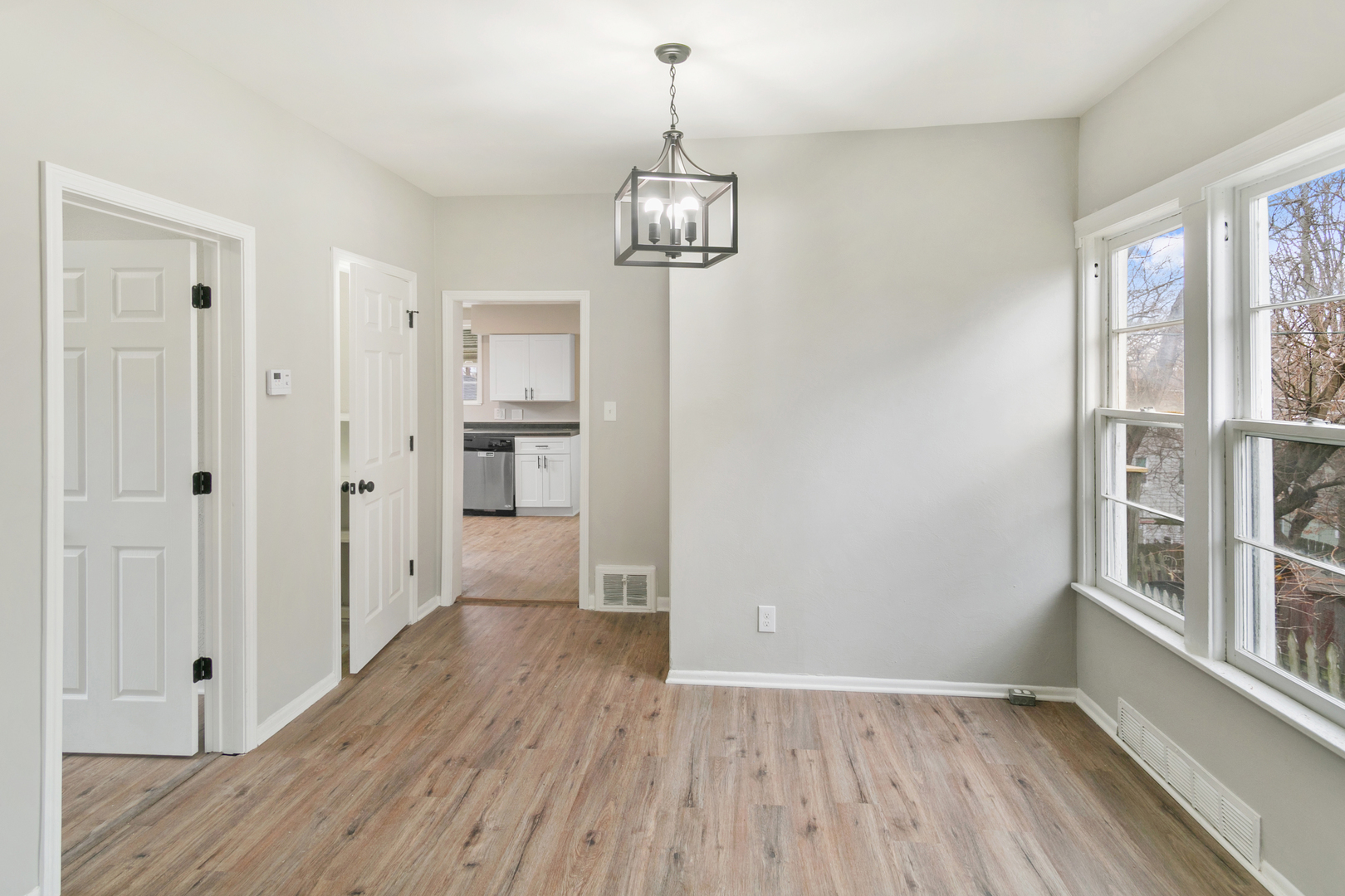8 Ivy Street Joliet, IL 60436 - Photo 5 of 13 a view of a hallway with wooden floor and a window