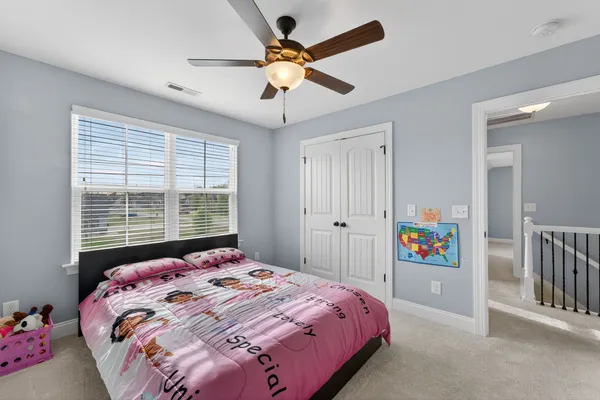 a view of a livingroom with furniture and a flat screen tv