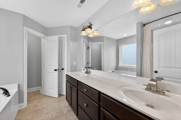 an aerial view of residential houses with outdoor space and river