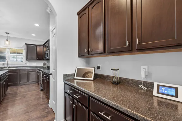 a kitchen with stainless steel appliances granite countertop a sink stove and microwave