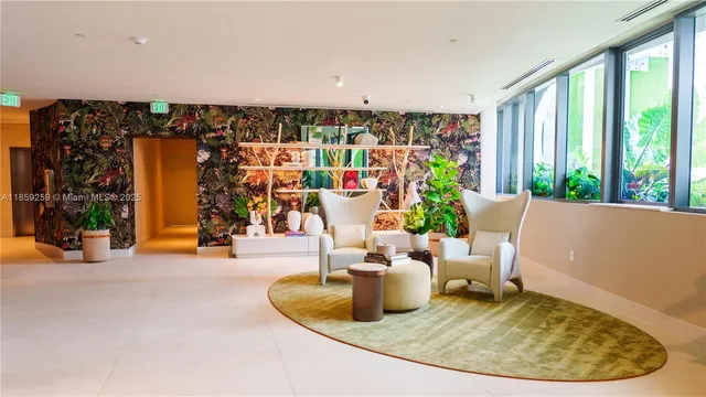 a living room with furniture and a potted plant