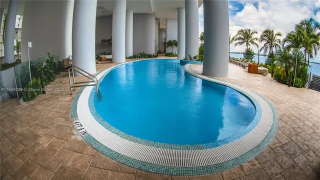 a view of a swimming pool with a lounge chair