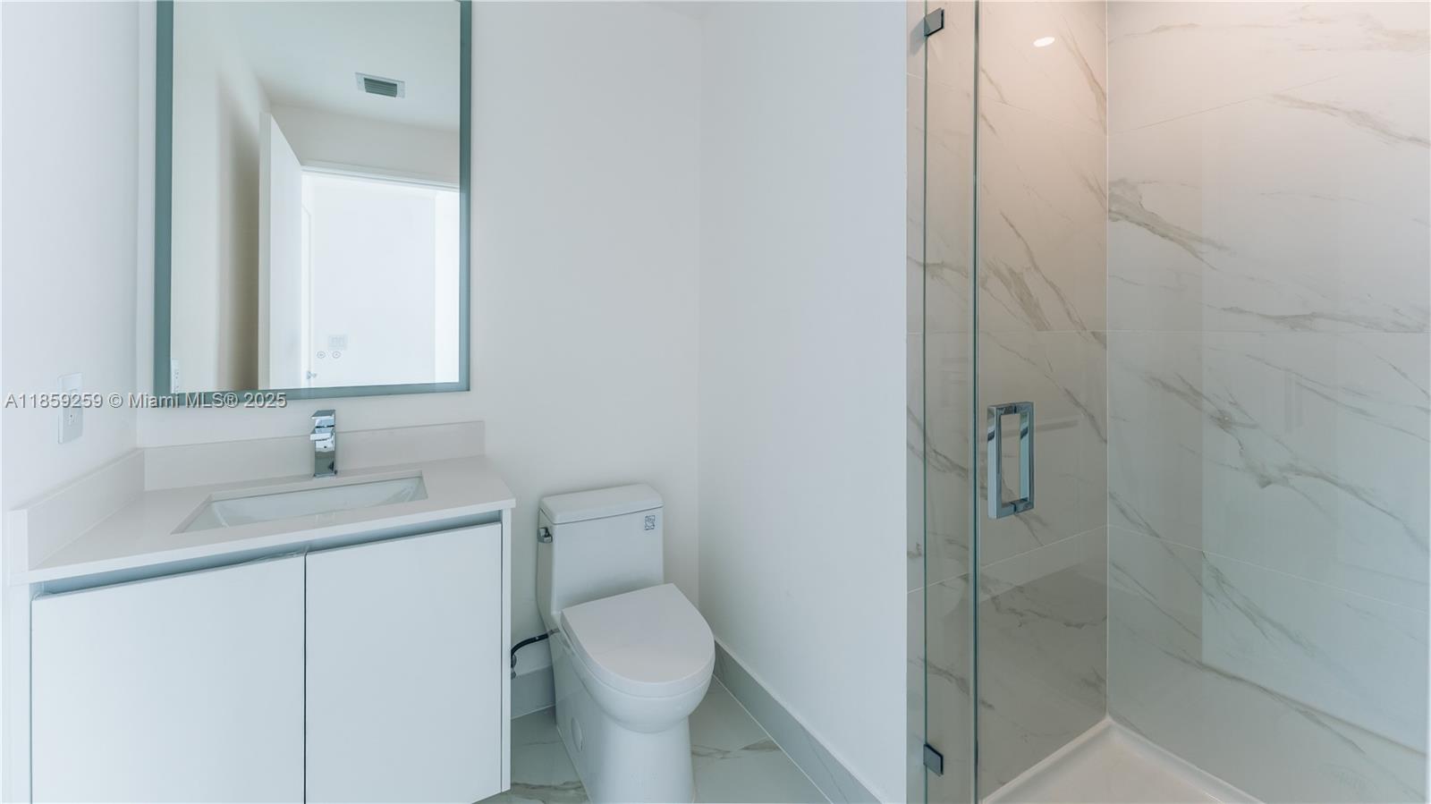 700 Northeast 24th Street, Unit 4407 Miami, FL 33137 - Photo 44 of 75 a bathroom with a granite countertop sink toilet and shower