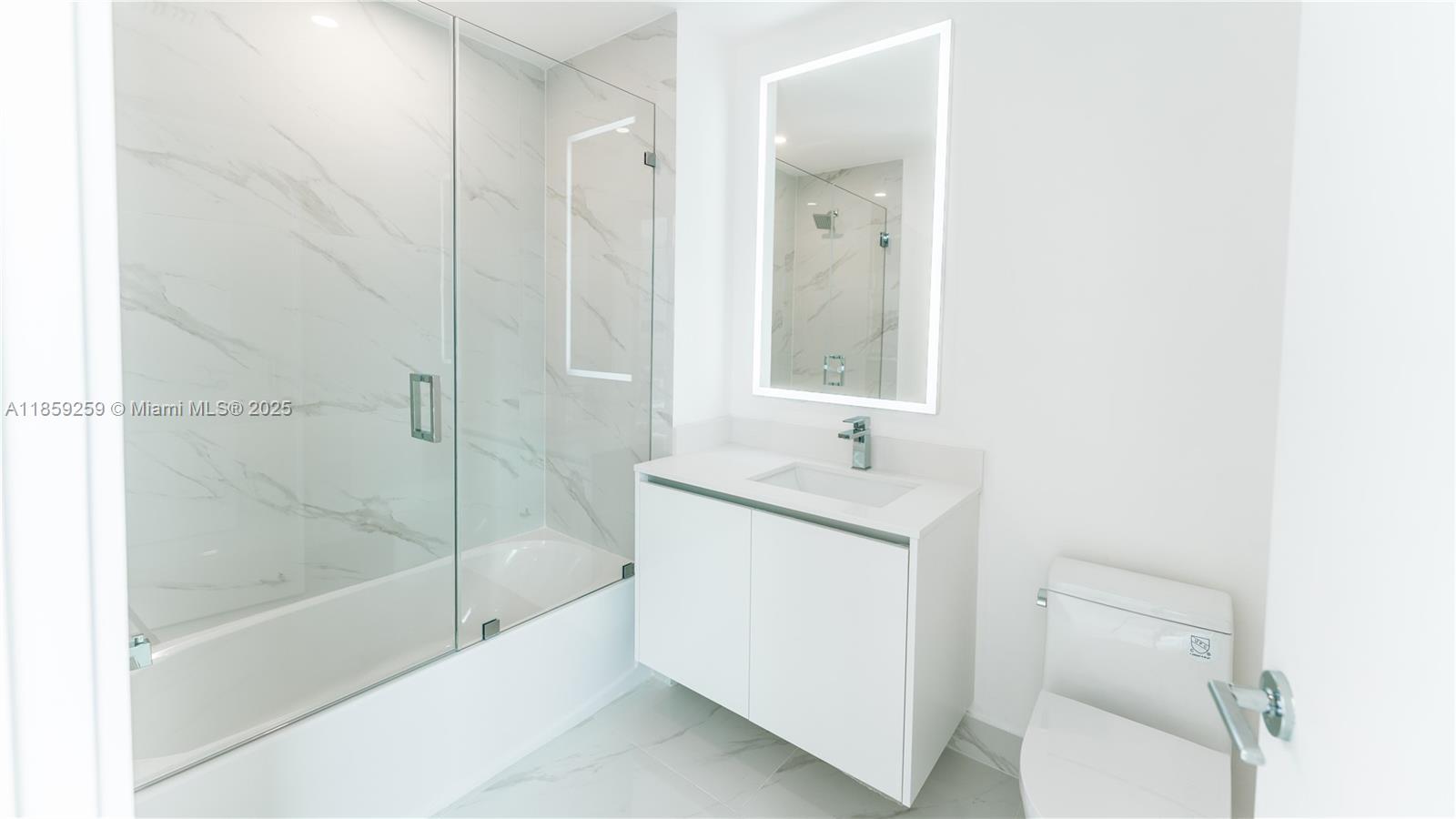 700 Northeast 24th Street, Unit 4407 Miami, FL 33137 - Photo 48 of 75 a bathroom with a sink toilet and shower