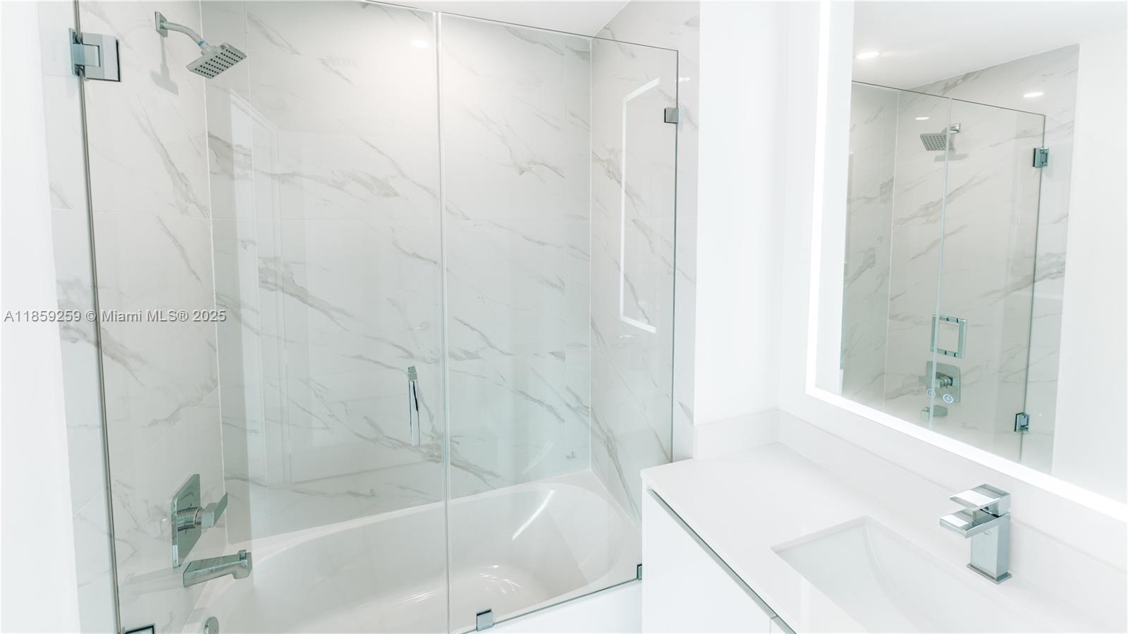 700 Northeast 24th Street, Unit 4407 Miami, FL 33137 - Photo 49 of 75 a bathroom with a bathtub and a sink