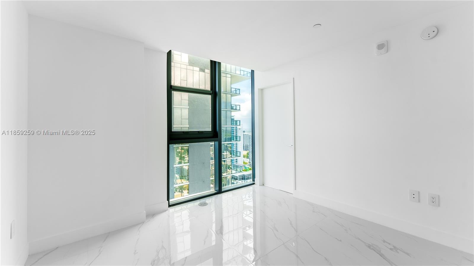 700 Northeast 24th Street, Unit 4407 Miami, FL 33137 - Photo 52 of 75 a view of an empty room with window