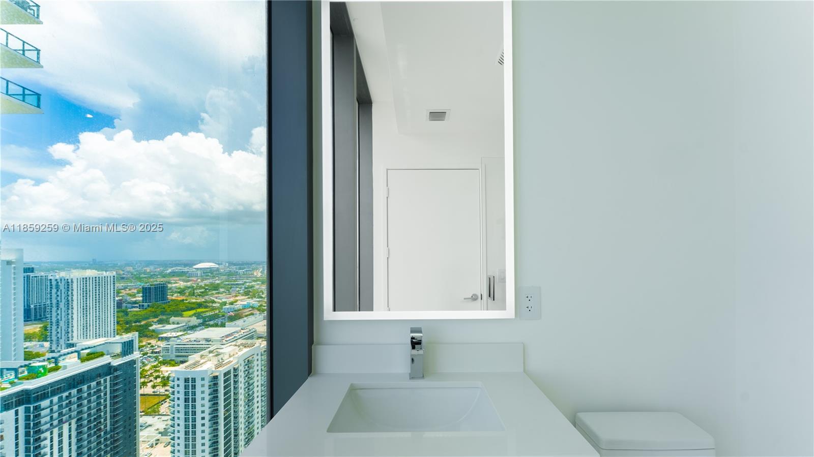 700 Northeast 24th Street, Unit 4407 Miami, FL 33137 - Photo 55 of 75 a bathroom with a toilet