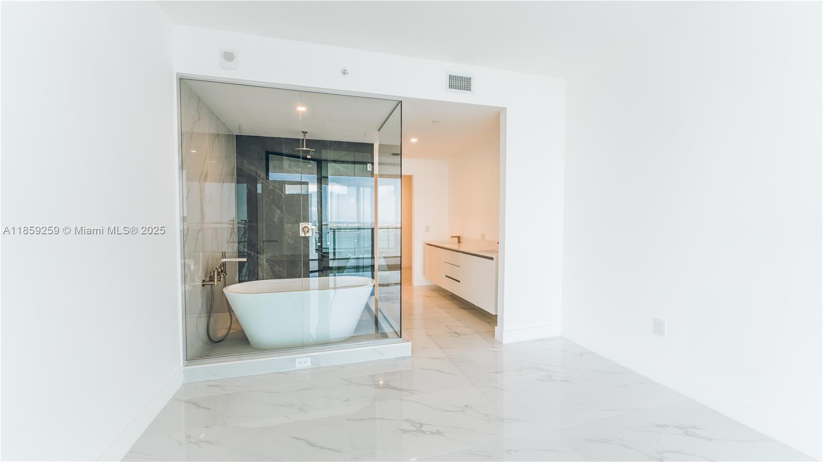 700 Northeast 24th Street, Unit 4407 Miami, FL 33137 - Photo 60 of 75 a bathroom with a bathtub and sink