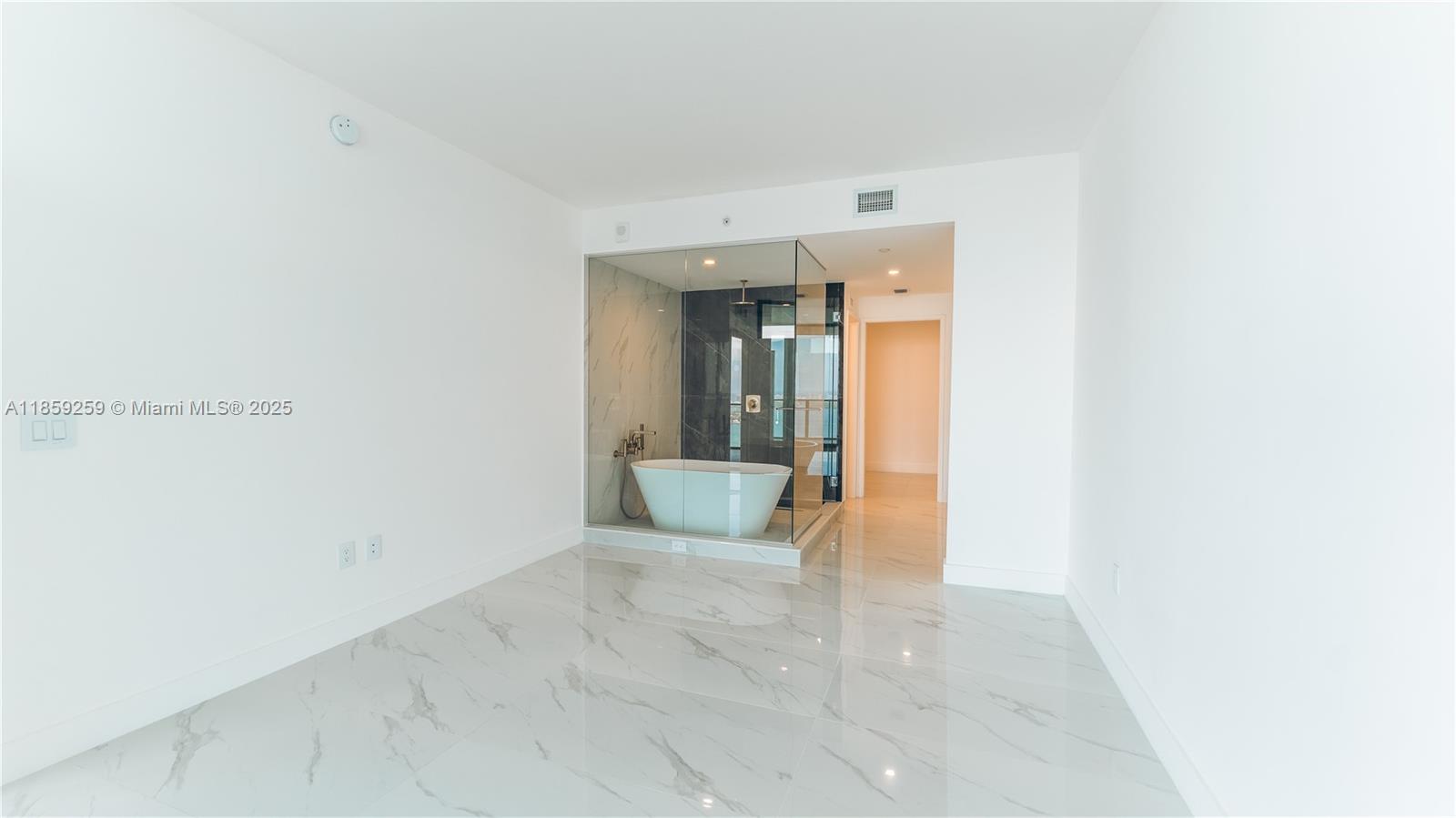 700 Northeast 24th Street, Unit 4407 Miami, FL 33137 - Photo 61 of 75 a view of a hallway with wooden floor and a bathroom